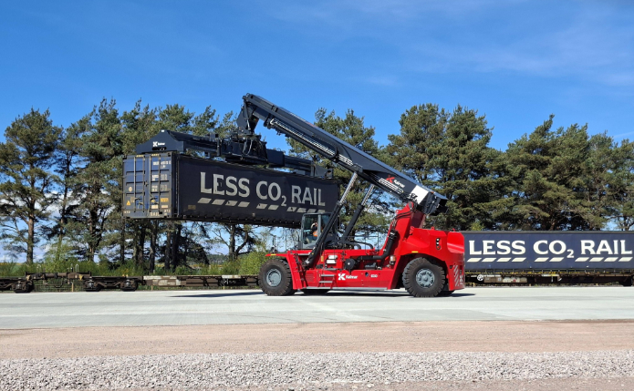 The reach stacker gets to work